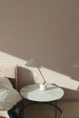 a white table with a lamp on it next to a bed at Contemporary villa near Sitges Hills in Avinyonet