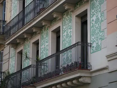 an apartment building with balconies and windows at Enric Granados 15 in Barcelona