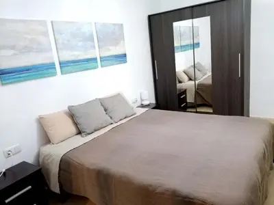 a bedroom with a large bed and a mirror at Enric Granados 15 in Barcelona