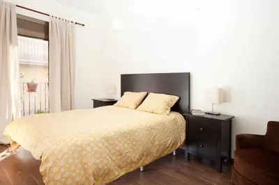 a bedroom with a bed and a window at Apart céntrico con terraza en Gracia in Barcelona