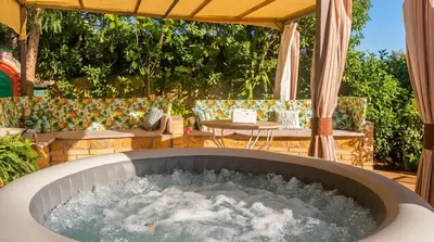 a long table with chairs and plates on it at Villa Sitges Ilusión 15 minutes by car from Sitges Sleeps 16 people XXL swimming pool in Olivella