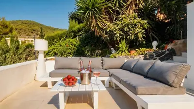 a villa with a swimming pool and a mountain at Villa Sitges Colonial. Impressive views of the sea. High design. Renovated. in Sitges