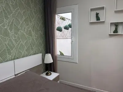 a bedroom with a bed and a window at COMFORTABLE APARTMENT CLOSE TO BUNKERS DEL CARMEL! in Barcelona