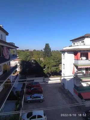 a parking lot with cars parked in front of a building at Apartamento Bella Carmen : para 6 personas in Cunit