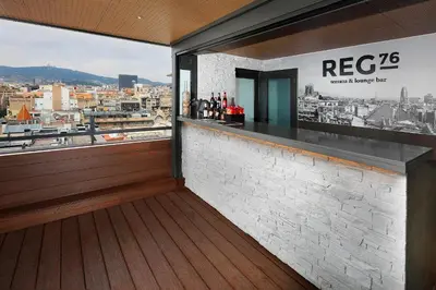 a living room with two red couches and a table at HCC Regente in Barcelona