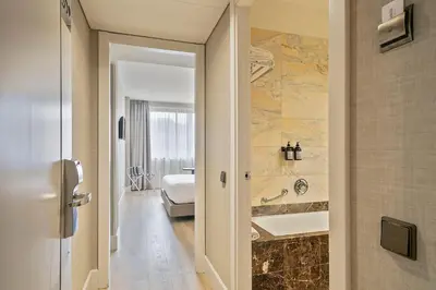 a bathroom with a tub and a toilet and a sink at Acta CITY47 in Barcelona
