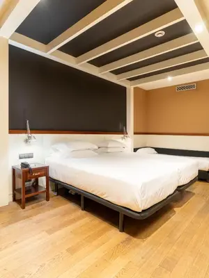 a bedroom with a large bed with a blackboard at U232 Hotel in Barcelona