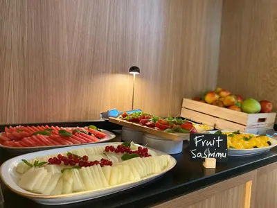a buffet with different types of food on a table at Onix Fira in Barcelona