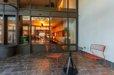 a table and chairs in front of a building at Onix Fira in Barcelona