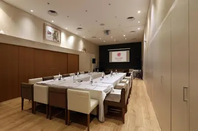 a large conference room with a long table and chairs at Guitart Grand Passage in Barcelona