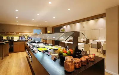 a kitchen with a counter with fruit on it at Guitart Grand Passage in Barcelona