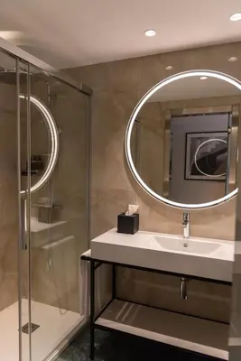 a bathroom with a sink and a mirror at Eurostars Cristal Palace in Barcelona
