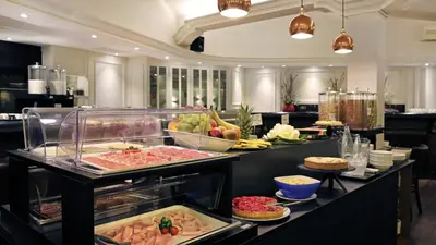 a buffet line with many different types of food at Arc La Rambla in Barcelona