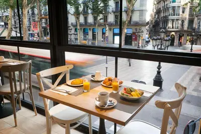 a table with food on it in front of a window at Royal Ramblas in Barcelona