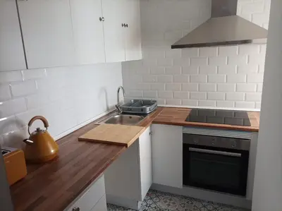 a kitchen with a sink and a stove at COOL! 5' to metro. 15' to Center/beach by metro. in Santa Coloma de Gramanet
