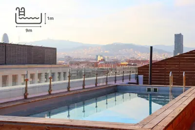 a balcony with a table and chairs on the beach at Eurohotel Diagonal Port in Barcelona