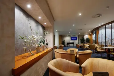 a restaurant with chairs and tables and a bar at HCC Montblanc in Barcelona