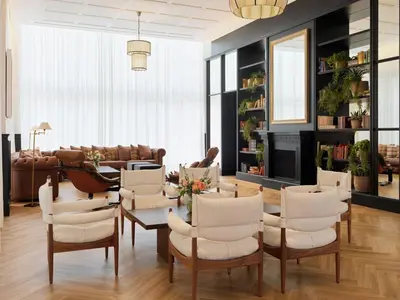 a living room with a table and chairs at H10 Itaca in Barcelona
