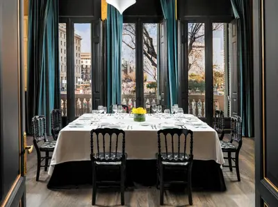 a table in a room with a view of a city at Boutique Hotel H10 Catalunya Plaza in Barcelona