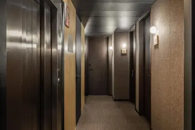 a corridor of a hallway with doors and a hallwayngth at Ronda House in Barcelona