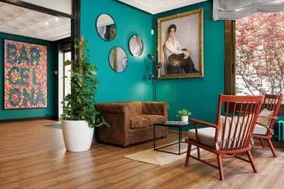 a living room with a couch and a painting on the wall at Bonanova Park in Barcelona