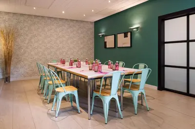 a conference room with a long table and chairs at Bonanova Park in Barcelona