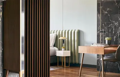 a living room with a radiator and a table at Grand Hyatt Barcelona in Barcelona