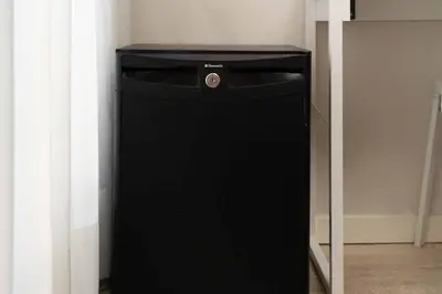 a hotel room with two beds and a television at Paral·lel in Barcelona
