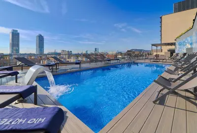 a swimming pool on the roof of a building at H10 Marina Barcelona in Barcelona