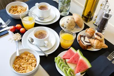 a table topped with plates of breakfast foods and drinks at Casual Colours Barcelona in Barcelona