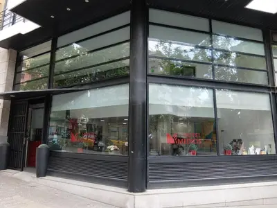 a window of a store with a lot of glass at Hotel Medicis in Barcelona