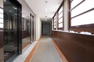 a hallway of a building with a window at Acta Atrium Palace in Barcelona