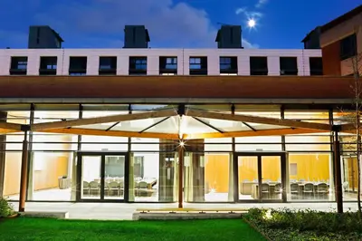 an external view of a building with large windows at Hotel Alimara in Barcelona
