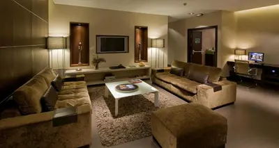 a living room with two couches and a tv at Hotel Constanza in Barcelona