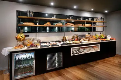 a buffet line with a lot of food on display at Wilson Boutique Hotel in Barcelona