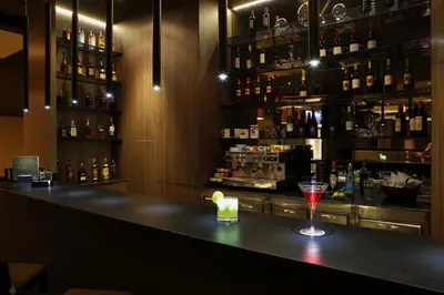 a bar with a wine glass sitting on a counter at Attica 21 Barcelona Mar in Barcelona