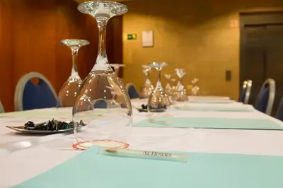 a long table with wine glasses on top of it at Hotel Viladomat in Barcelona