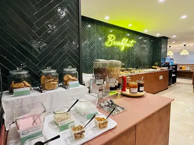 a buffet with food on a table in a store at Hotel Viladomat in Barcelona