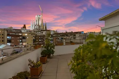 a balcony with a view of a city at sunset at Hotel Best Aranea in Barcelona