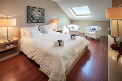 a bedroom with a large bed with a bow on it at Habitat Apartments Tessa in Barcelona