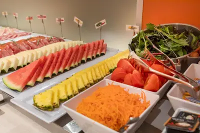 a buffet with many different types of fruits and vegetables at Acta Sant Just in Sant Just Desvern