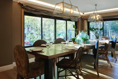 a dining room with a wooden table and chairs at Acta Splendid in Barcelona