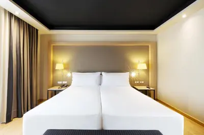 a hotel room with a sink and a desk at Hotel Jazz in Barcelona
