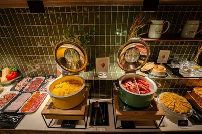 a kitchen with a counter with pots and pans at Zenit Borrell in Barcelona