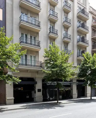 a hotel room with a bed and a flat screen tv at Catalonia Diagonal Centro in Barcelona