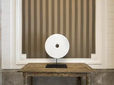 a roll of toilet paper sitting on a wooden table at Catalonia Portal de l'Angel in Barcelona