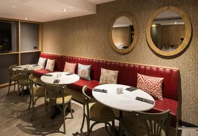 a dining room with wooden tables and chairs at Catalonia Born in Barcelona