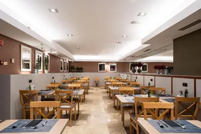 a table with several trays of different types of food at Catalonia Born in Barcelona