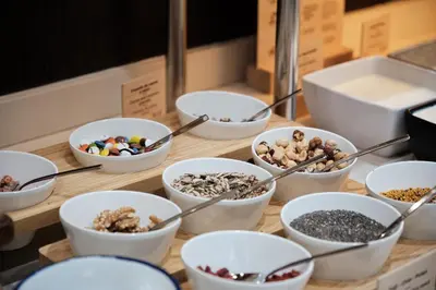 a table topped with bowls of different types of food at Catalonia Sagrada Familia in Barcelona