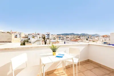 a balcony with a table and chairs and a view at Sitges Group Ocean in Sitges